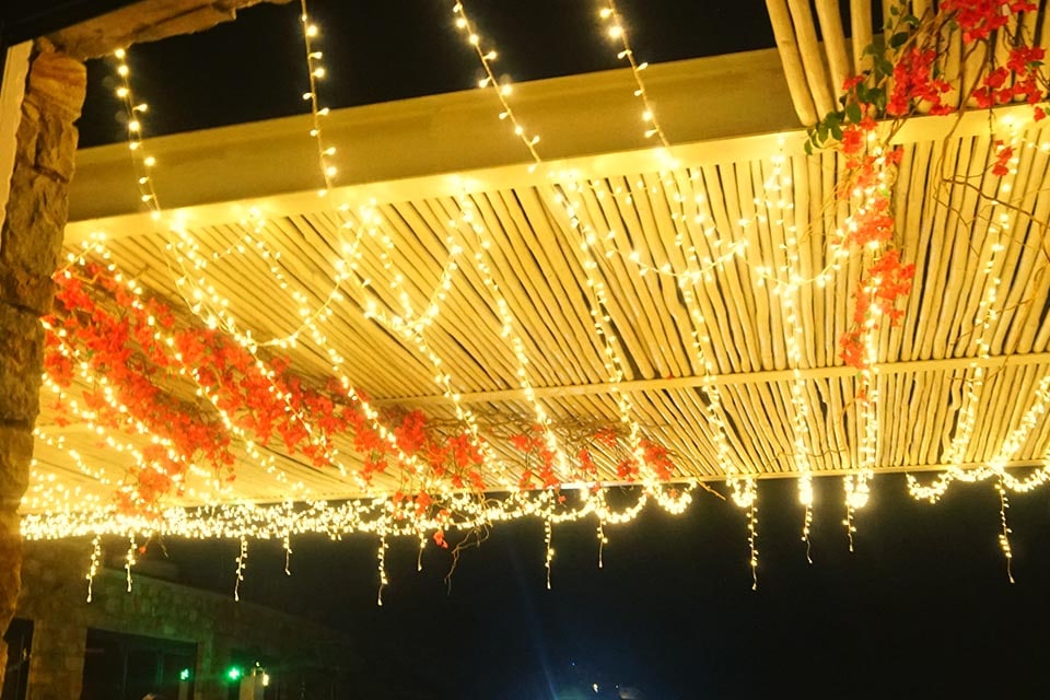 Huge Shelter Covered With Fairy Lights for a Wedding in Mykonos